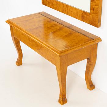 A mirror with console table, early 20th century.