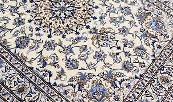 A rug, Nain part silk, ca 235 x 160 cm.