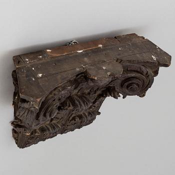 An 18th/19th century carved wood corinthian capital.