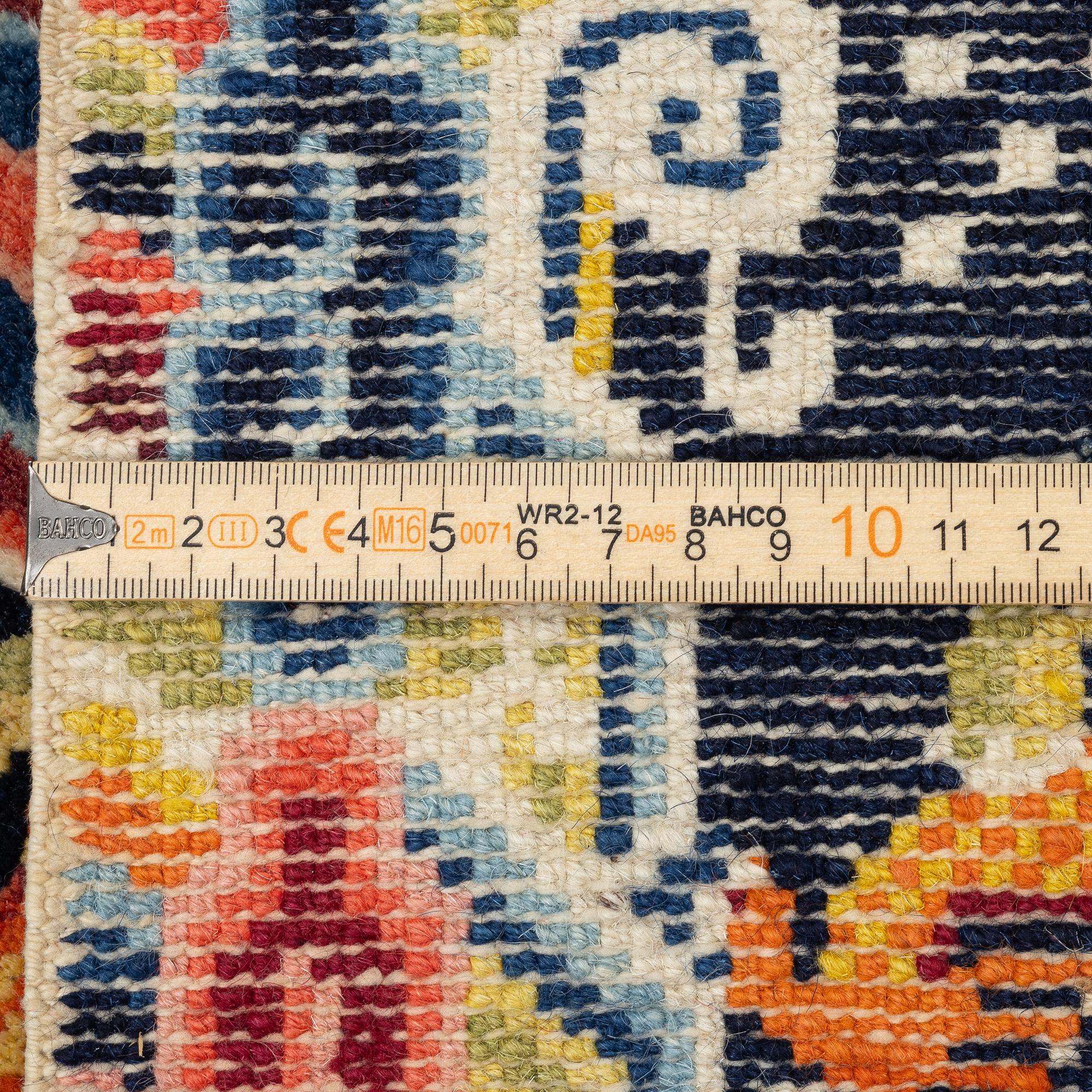 A Chinese small square rug, semi-antique, 65 x 68 cm.