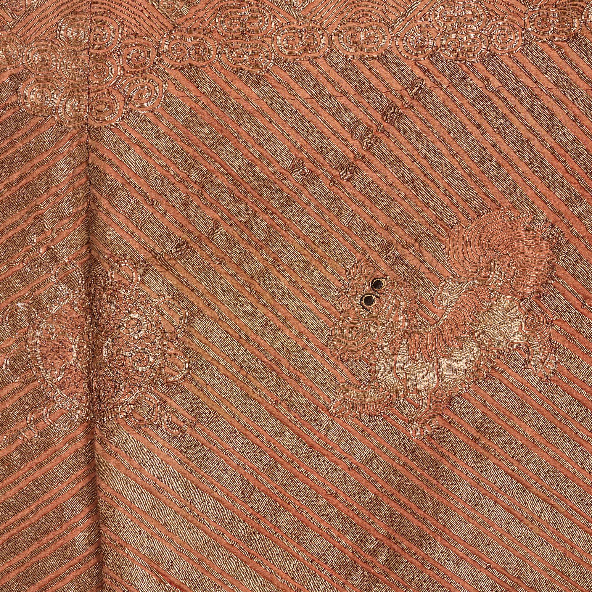 A ROBE, embroidered silk, height 131 cm, China late Qing dynasty (1644-1912).