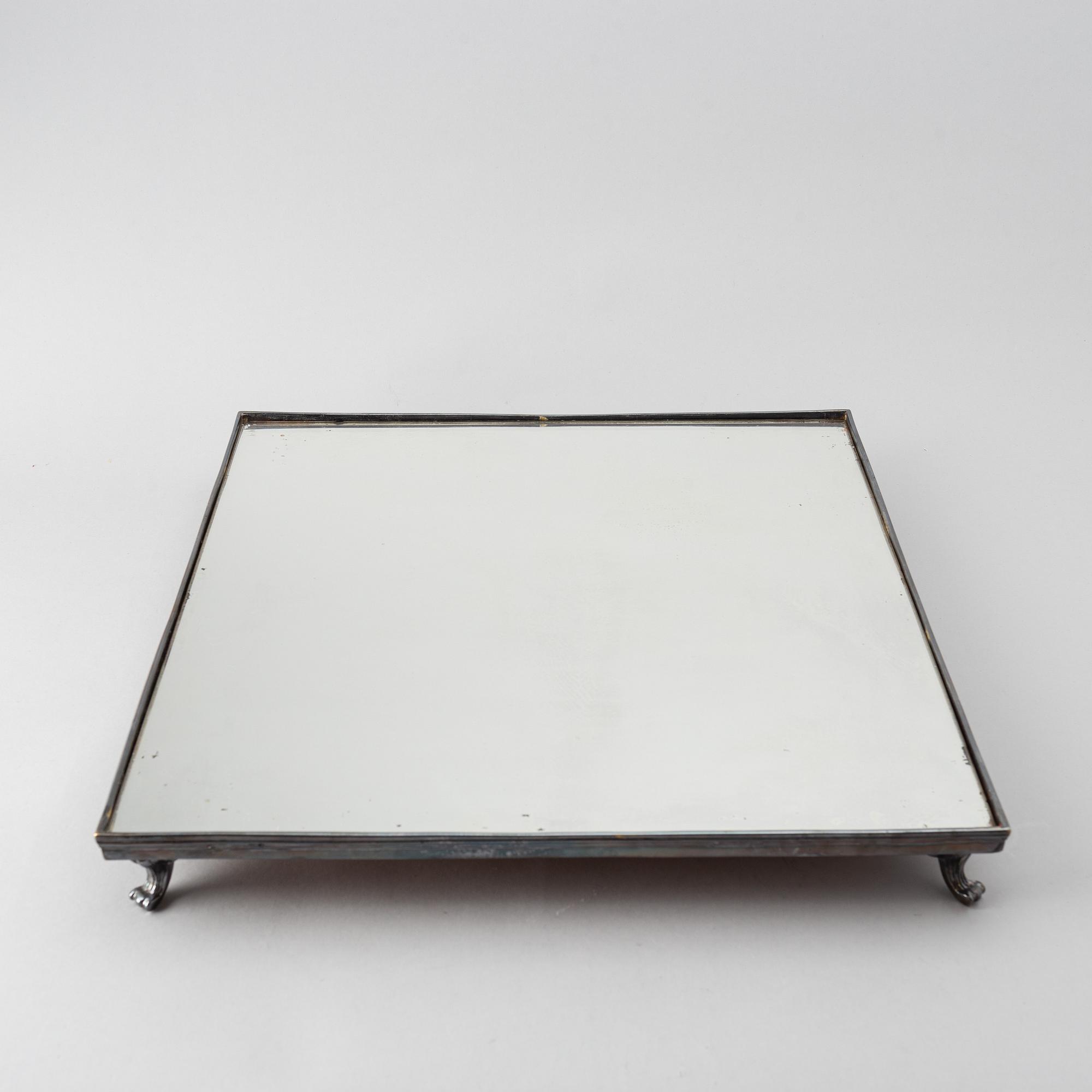 A 20th century silver plated mirror plateau.