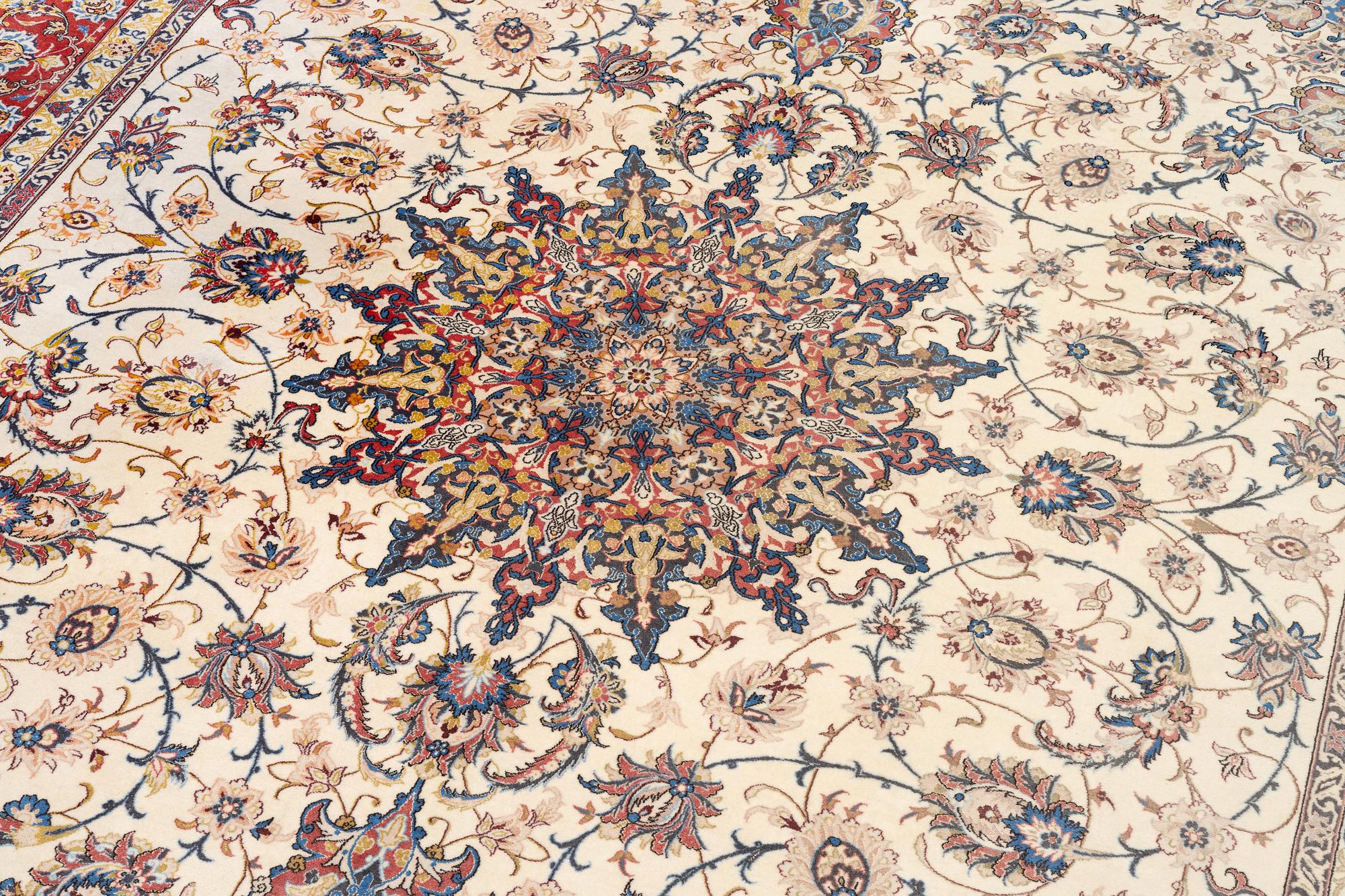 An Isfahan carpet, signed, approx. 372 x 255 cm.