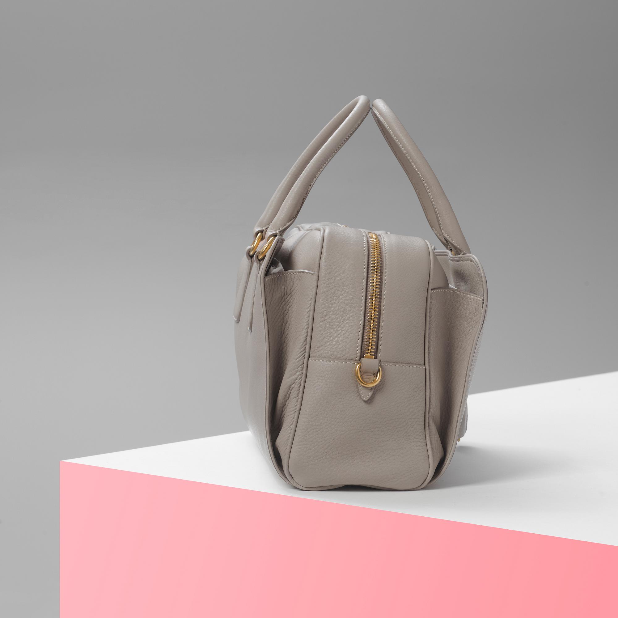 A leather handbag by Prada.