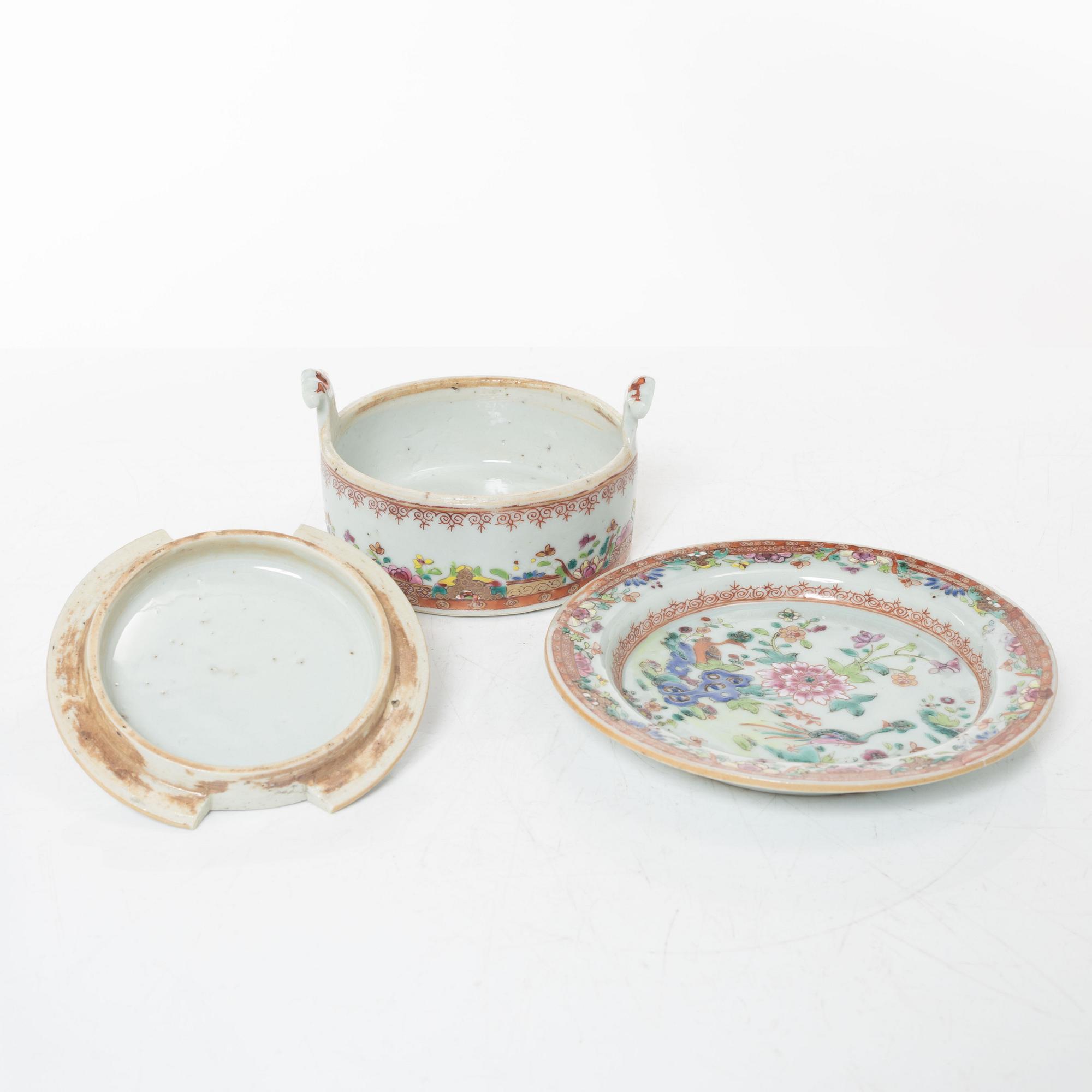 A small Chinese famille rose porcelain tureen with cover and stand, two salt cellars, Qing dynasty, Qianlong (1736-95).