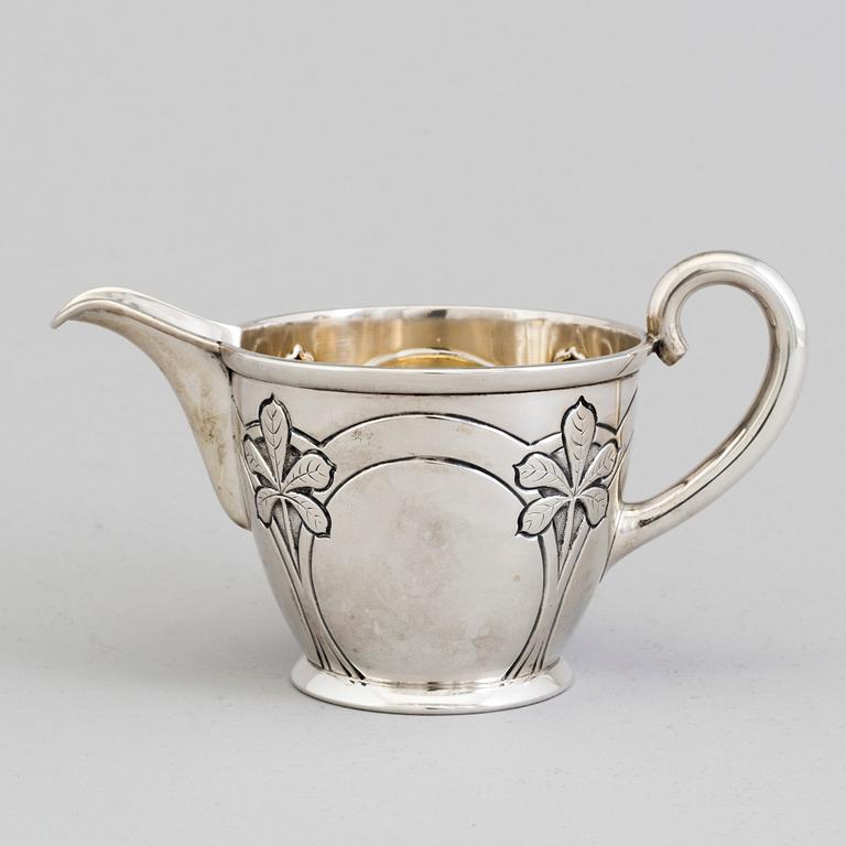 A Danish Art Nouveau parcel-gilt cream jug, maker's mark Franz Hingelberg, Aarhus 1909.
