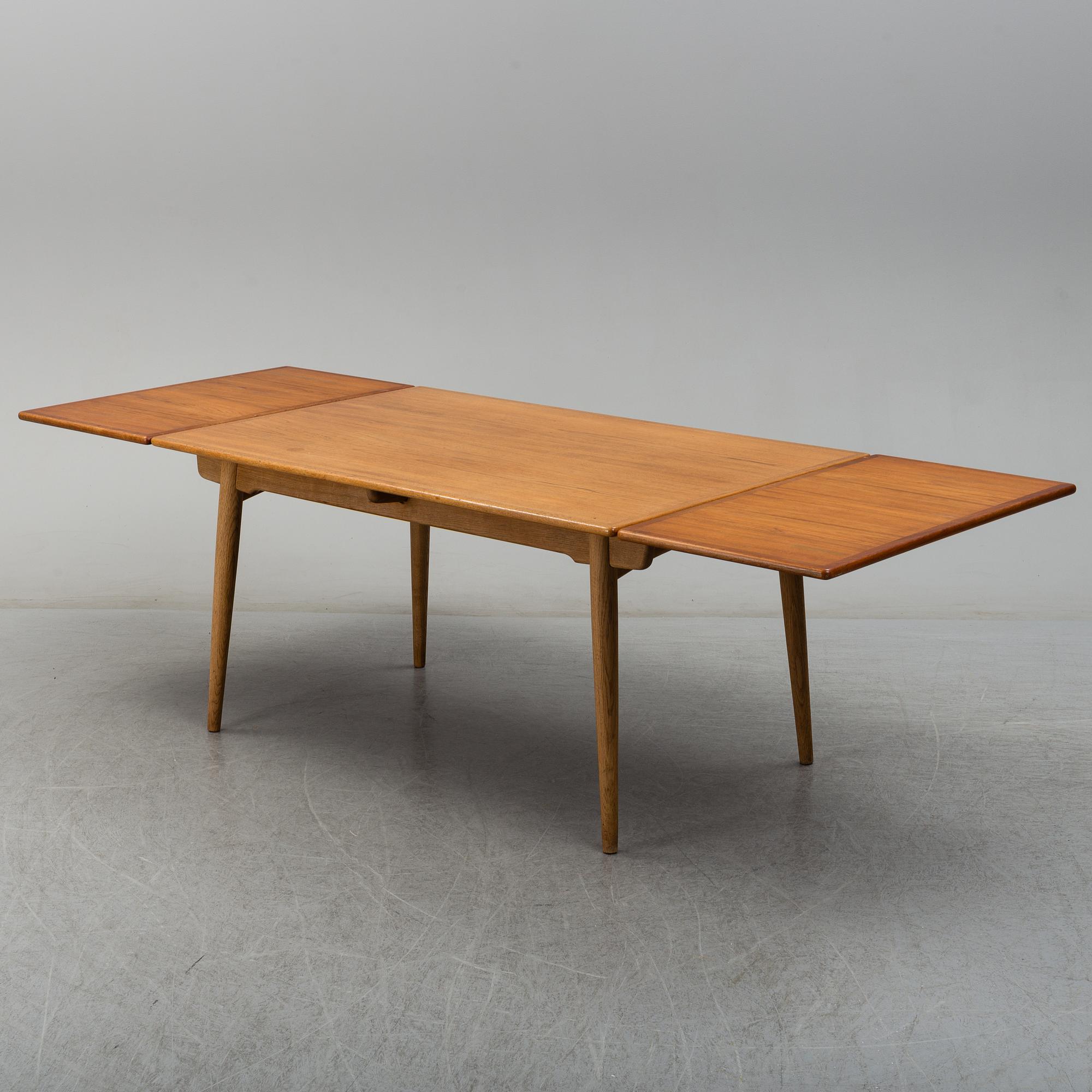 HANS J WEGNER, a model 'AT312' teak and oak dining table from