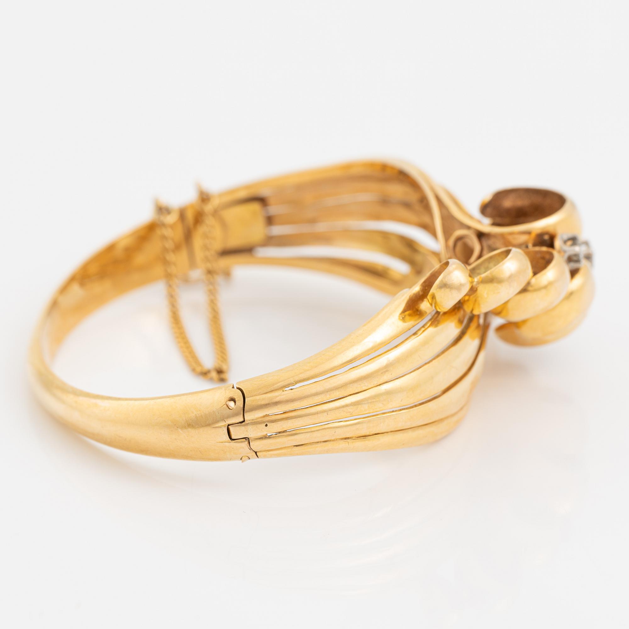 Brilliant cut diamond gold bangle.