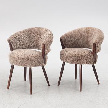 A pair of armchairs, AB Bröderna Biörs Snickerifabrik, mid-20th century.
