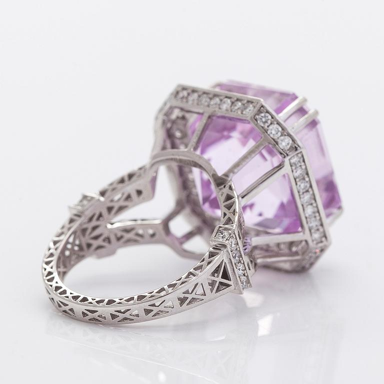 A 14K gold ring with kunzite and diamonds.