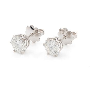 Earrings, single-stone earrings in 18K white gold with brilliant-cut diamonds, accompanied by IGI report.