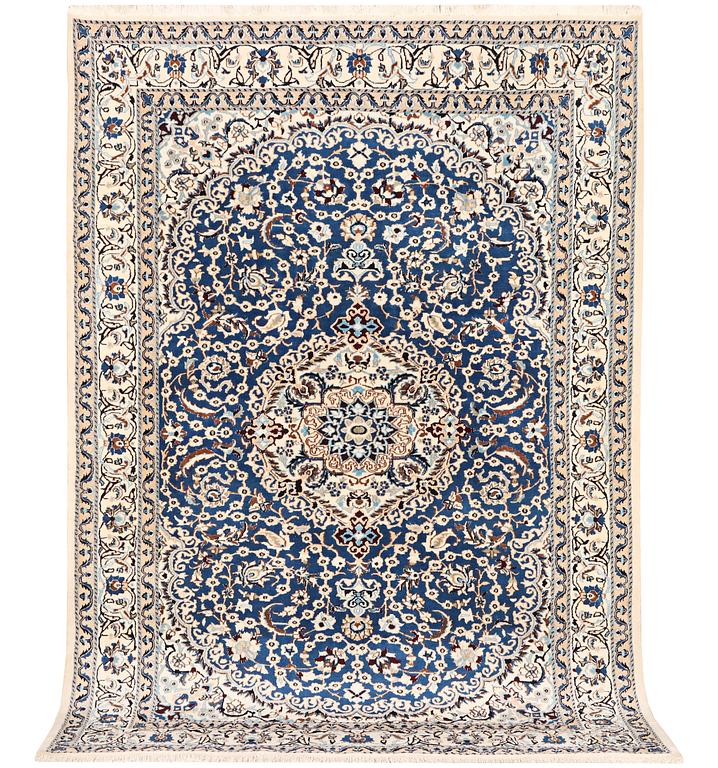 A Nain carpet, part silk, 9 laa, c. 300 x 189 cm.