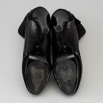 Black suede bootie by Ralph Lauren.