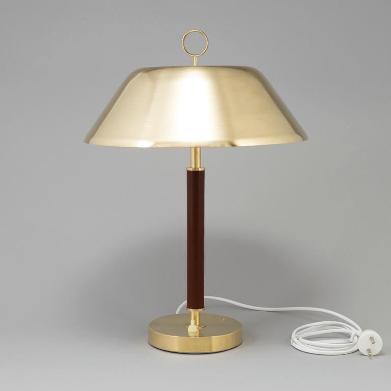A brass and leather table light from Falkenbergs Belysning, second half of the 20th Century.