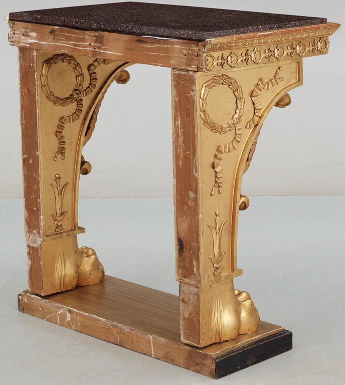 A Swedish Empire 19th century console table with porphyry top.