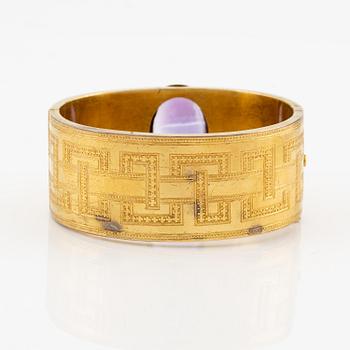 A 14K gold braclet with a faceted amethyst.