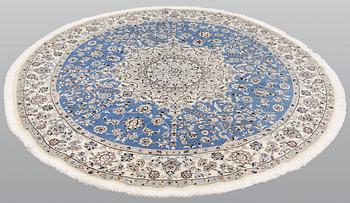 A round part silk Nain rug, so called 9 LAA, diameter 195 cm.