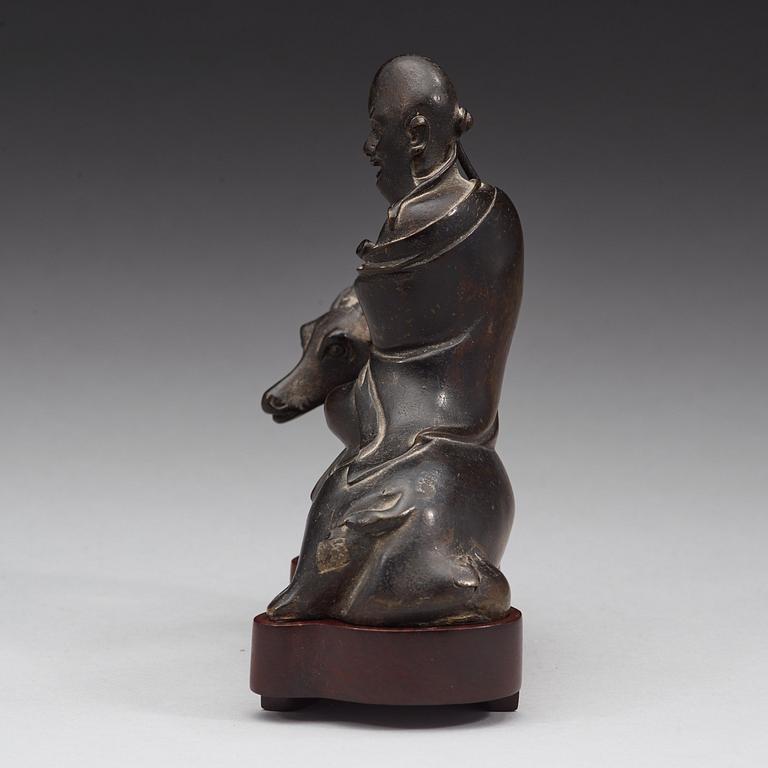 A bronze figure of Sholou on a reclining deer, Qing dynasty (1644-1912).