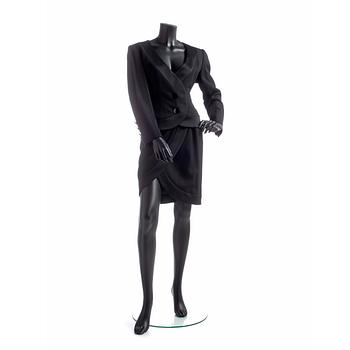 573. YVES SAINT LAURENT, a black wool dress.