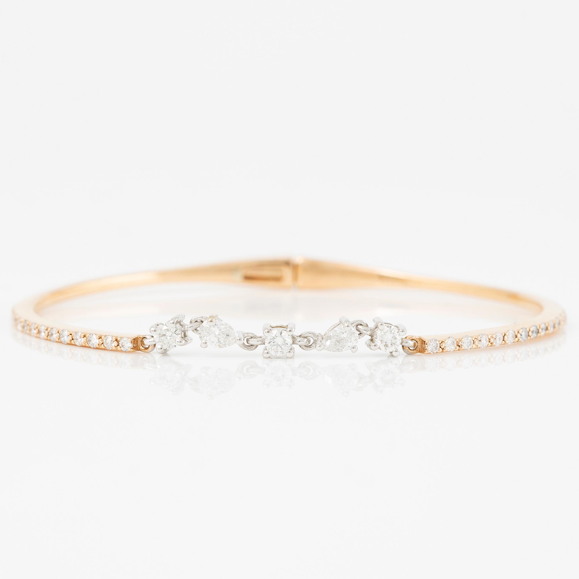 Bracelet in 18K gold with pear-shaped and brilliant-cut diamonds.