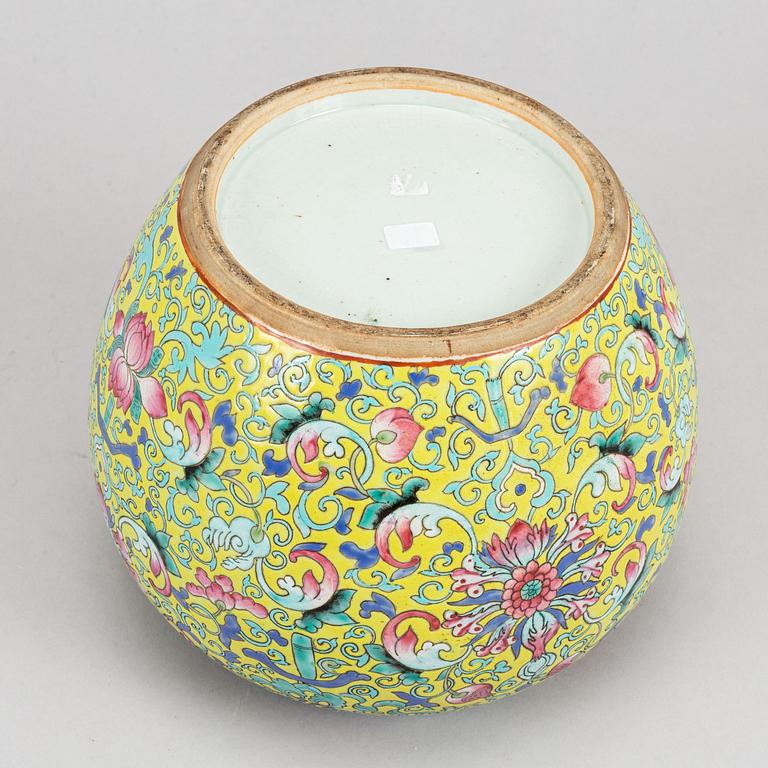 A yellow ground famille rose lotus jar, China, early 20th Century.