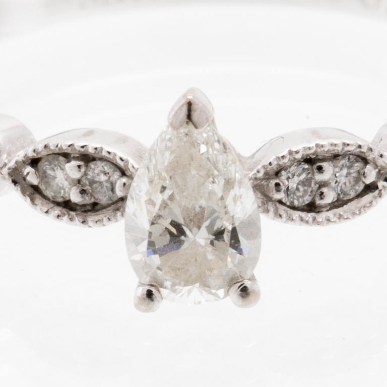 Ring in 18K white gold with a pear-cut diamond and round brilliant-cut diamonds, Van Bruun.