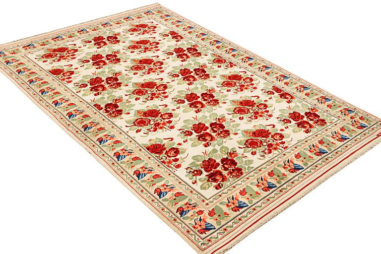 A carpet with a rose pattern, c. 310 x 196 cm.