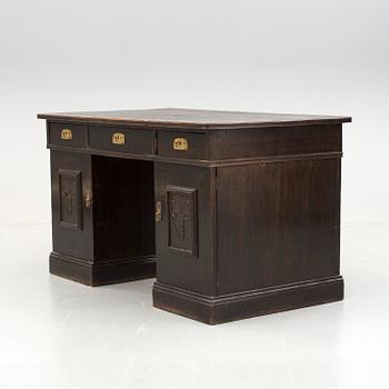 An early 1900s oak writing desk.
