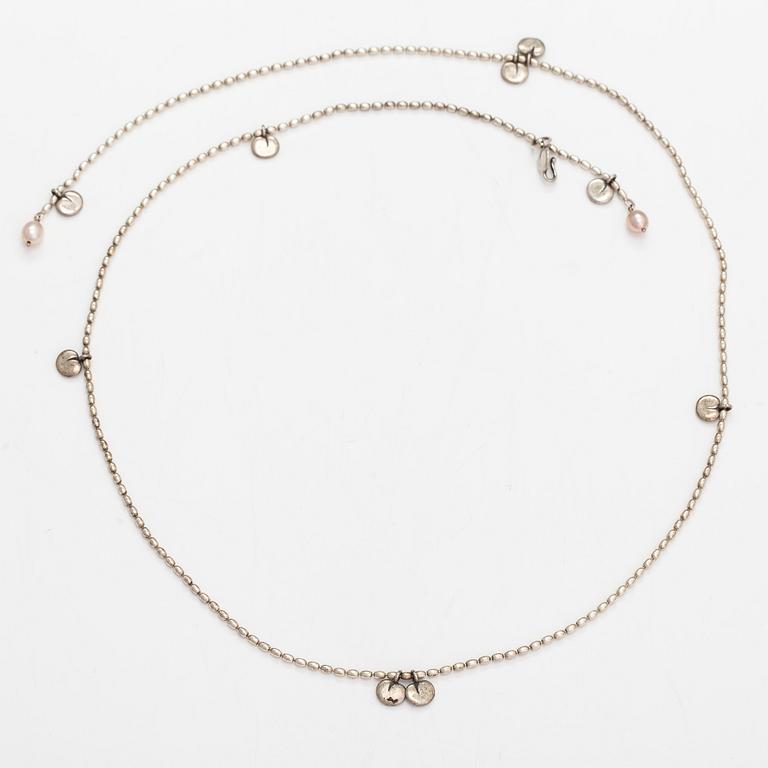 Kirsti Doukas, a necklace, pair of earrings and two bracelets, 'Vanamo', sterling silver, and cultured pearls.