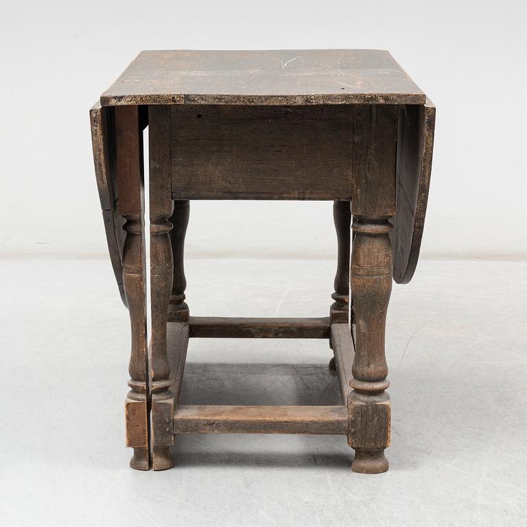 A Baroque-style gate leg table, 19th century.