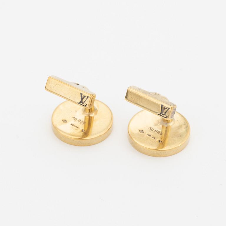 Louis Vuitton, a pair of cufflinks in a damier ebene case.