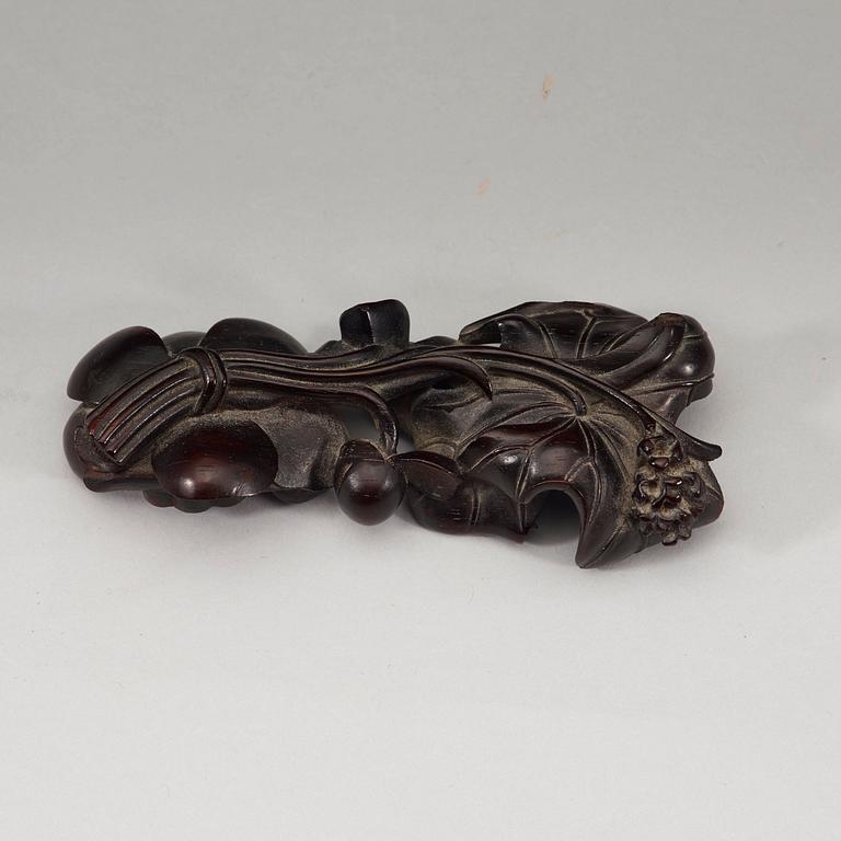 A finely carved Zitan "Lotus" stand, Qing Dynasty (1644-1912).