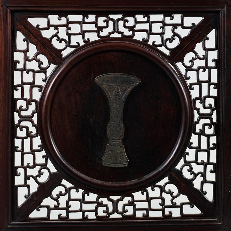 A four panel screen with porcelain placques, Qing dynasty, 19th Century.