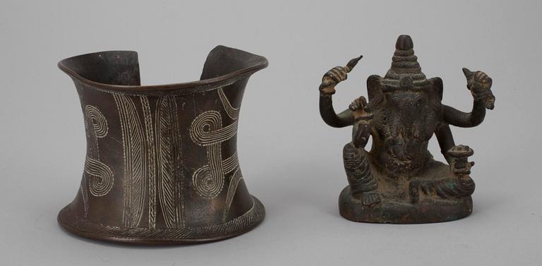 A SCULPTURE, god Ganesha, India 20th century. BRACELET, bronze, Africa, 20th century.