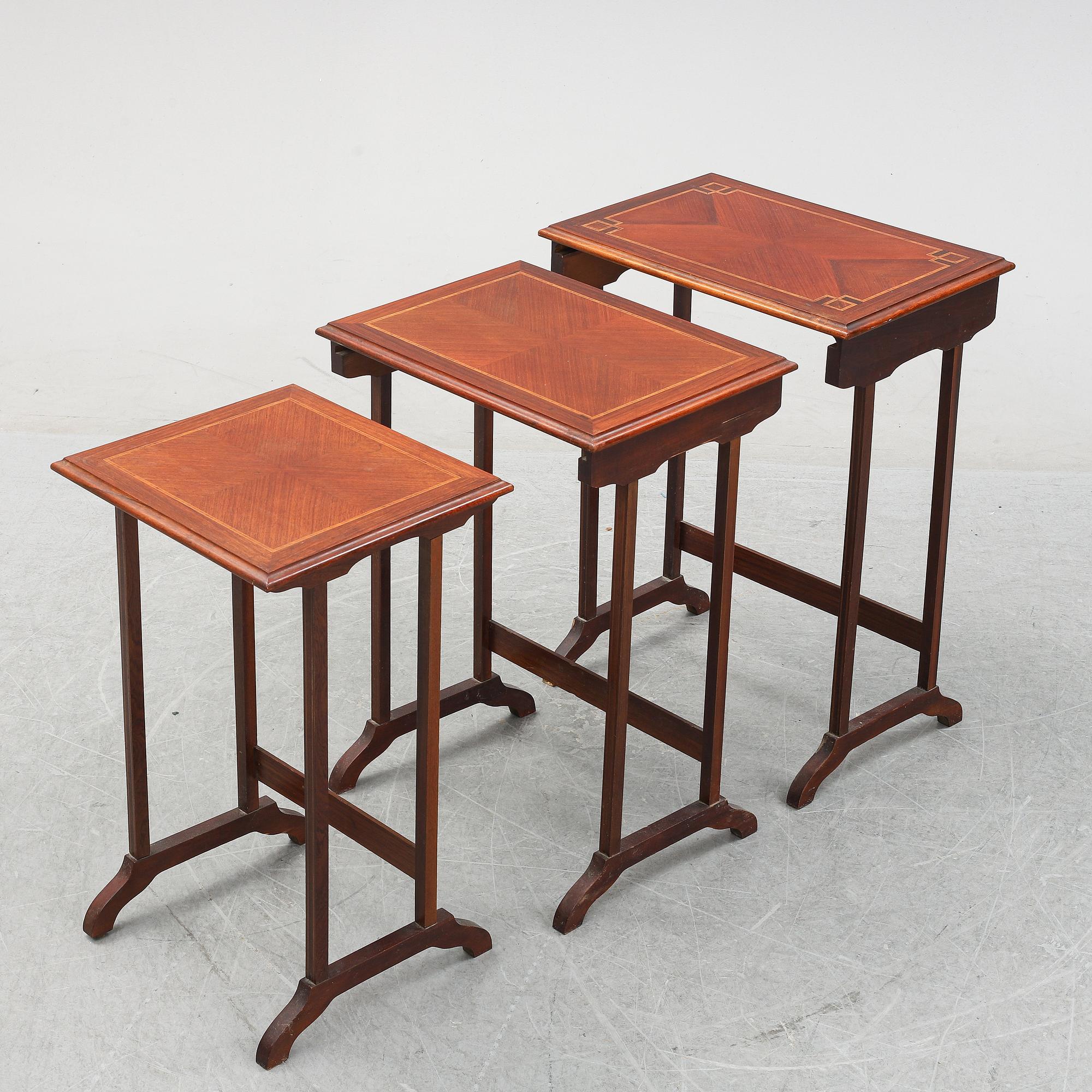 A three piece nesting table with inlay, first half of the 20th Century.