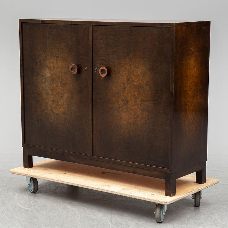 A stained birch veneered cabinet, 1930's.