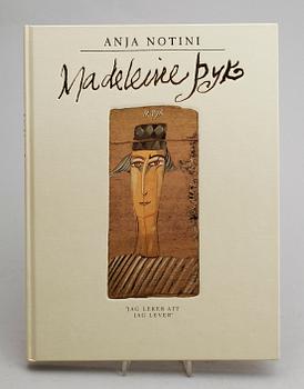 BOK, "En Bok om Madeleine Pyk", av Anja Notini, med färglitografi, signerad, numrerad 131/197.