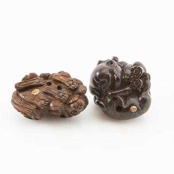 Netsuke, two pieces, hardwood. Japan, 20th century.