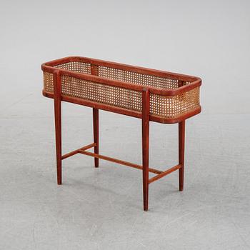 A flowertable with rattan details, late 20th century.