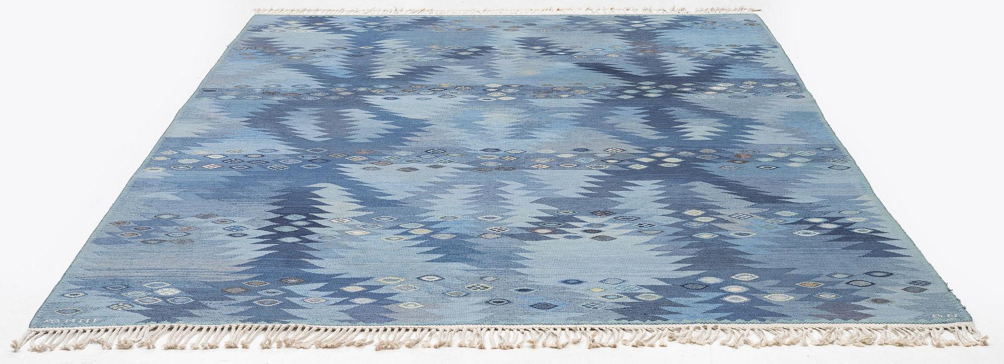 Barbro Nilsson, a carpet, 'Tånga mellanblå', flat weave, c. 350 x 252 cm, signed AB MMF BN.