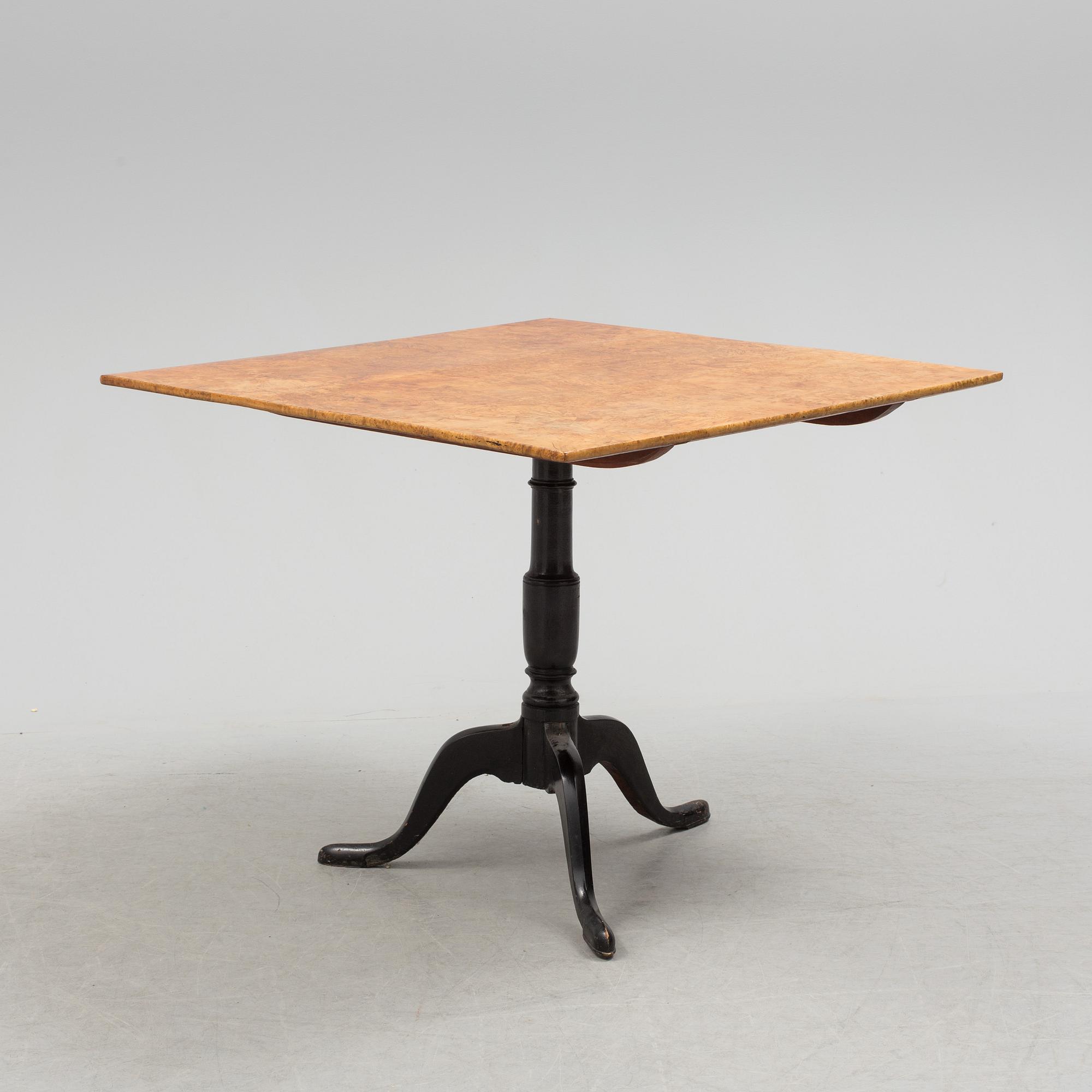 A 19th century folding table with root veneer.
