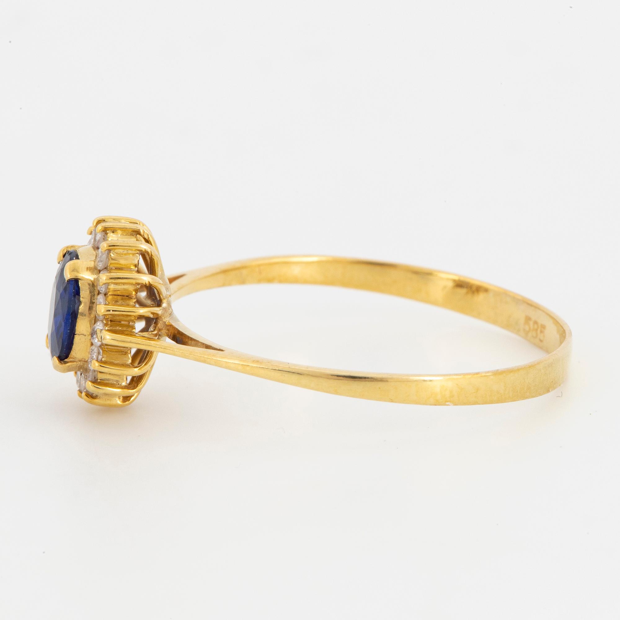 Oval mixed-cut sapphire and round brilliant-cut diamond halo ring.