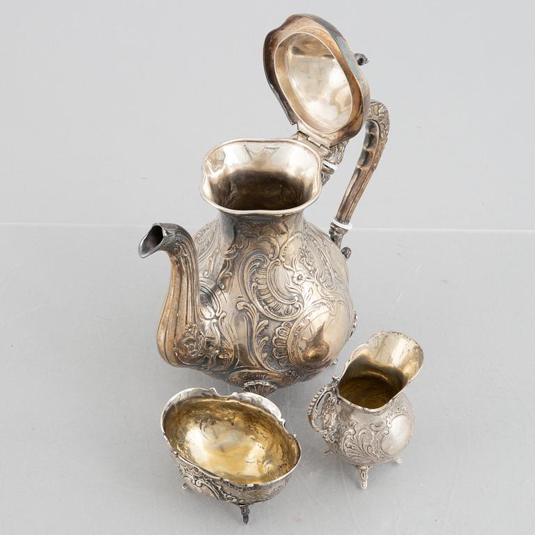 A silver coffee pot, creamer and sugar bowl, including GEWE, Malmö 1973. Rococo style.