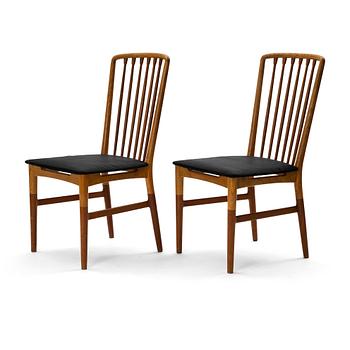 A pair of Scandinavian Mid Century Modern teak, oak and elm chairs.