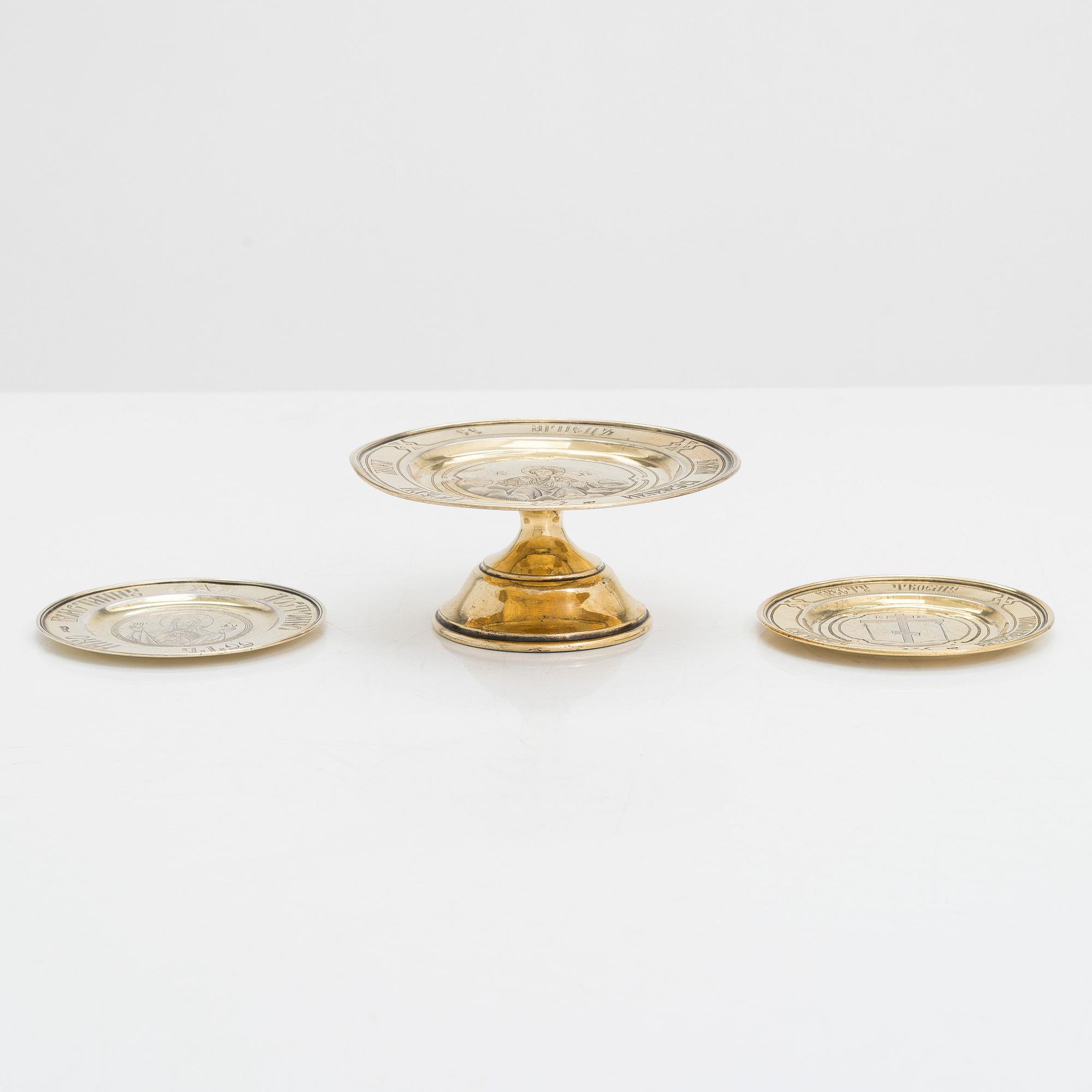 Three 19th-century gilt silver paten, two by master Dmitry Maksimovich Shelaputin, Moscow, 1876-77.
