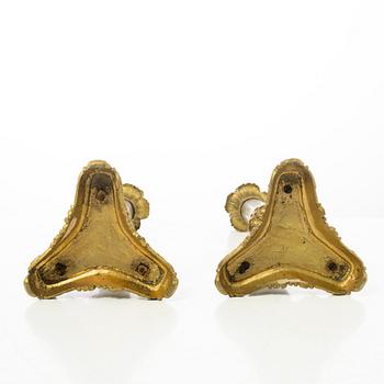 A pair of brass and bronze late Empire candle sticks, mid 20th century.