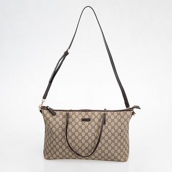 Gucci, a canvas tote bag.