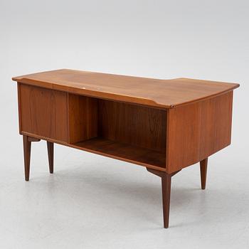 A teak veneered desk, 1950's/60's.