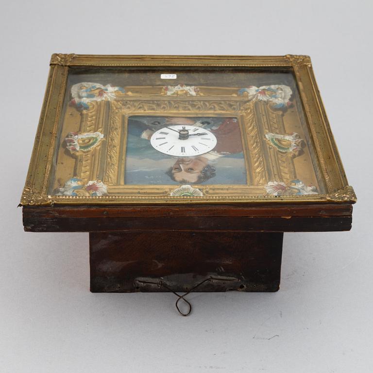 A Schwarzwald area wall pendulum clock with mechanical eye-movment, mid 19thcentury.
