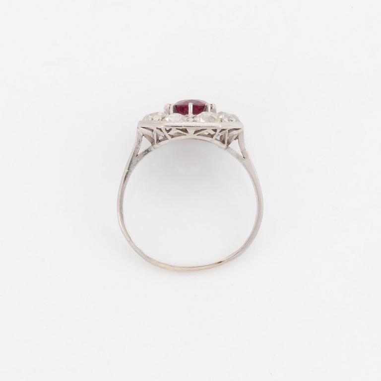 An 18K white gold ring set with a ruby and old-cut diamonds.